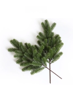 Detailed view of artificial green pine needles branches for Christmas decoration