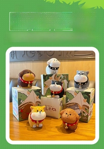 Set of six mini resin puppy figurines with realistic fur texture on a wooden desk
