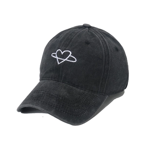 Close-up of heart embroidery on vintage washed dark grey cotton baseball cap detail