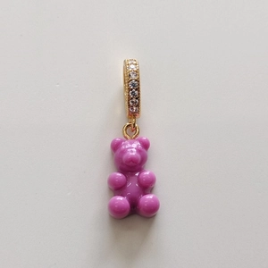 Detail of purple gummy bear pendant with gold crystal-encrusted loop for necklace