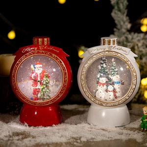 Christmas musical snow globe with Santa and snowman motifs and golden Merry Christmas text
