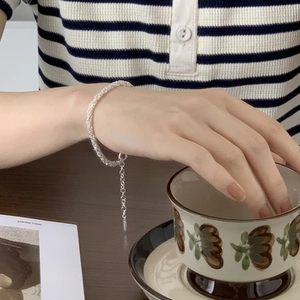 Elegant 925 sterling silver twisted rope chain bracelet worn on a female wrist