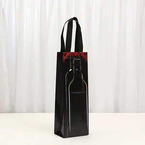 Black non-woven single wine gift bag with floral pattern and sturdy handles