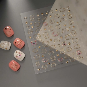 Süße Goldfolien-3D-Nagelaufkleber mit Cartoon-Bären und Hasen auf Marmorhintergrund