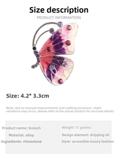 Detail view of purple butterfly brooch with rhinestone and alloy material specs