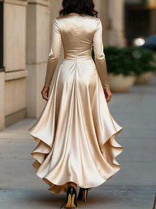 Detail of champagne satin dress showcasing back silhouette and elegant draped hemline
