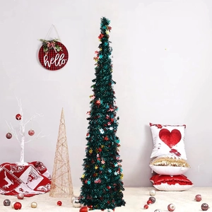 Close-up of green tinsel collapsible Christmas tree with colorful snowflake sequins