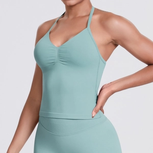 Detail of mint green seamless yoga vest with halter straps and gathered chest design