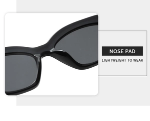 Detail view of the ergonomic nose pad on high-gloss black retro polygonal sunglasses