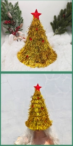 Detail showing a golden tinsel Christmas tree hat with red star and festive pom-poms