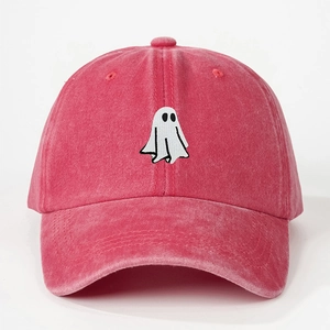 Close-up of pink washed cotton baseball cap featuring ghost embroidery and detailed texture