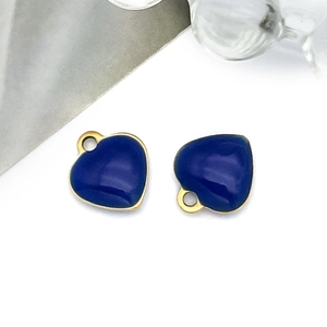 Close-up of royal blue enamel heart charms with gold plated edges for DIY jewelry