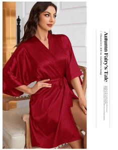 Elegant wine red satin robe with lace-up waist shown on model in home setting