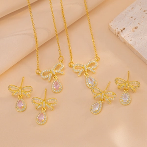 Bow heart jewelry set featuring zircon necklaces and earrings in pink and clear stones