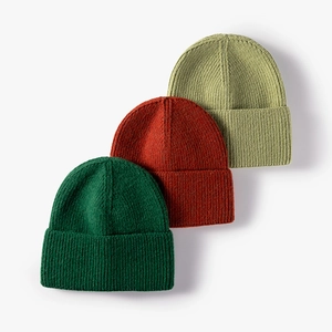 Three-pack winter ribbed knit beanies in forest green, rust red, and sage green colors