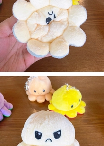 Detailed view of reversible plush octopus keychains showing various color combinations