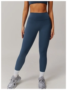 Detail of high-waist moisture-wicking yoga leggings with supportive compression waistband