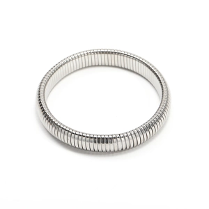 Detail view of a silver elastic metal bracelet with flexible stretchable ribbed links