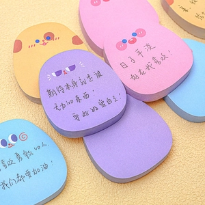 Colorful cartoon sticky notes in heart and cat shapes on a beige textured background