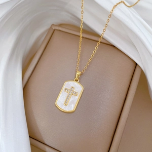Elegant gold titanium necklace with sparkling crystal cross and mother of pearl pendant