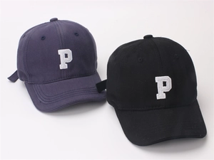 Close-up of adjustable back buckle and twill cotton fabric on embroidered baseball caps