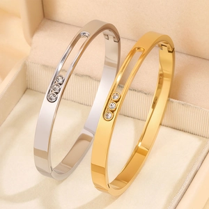 Polished titanium steel bangles with sliding triple diamonds in silver and gold finish