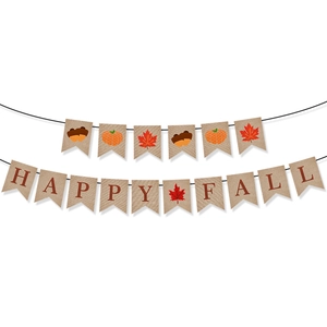Detail of burlap Happy Fall banner showing orange pumpkin and maple leaf textures