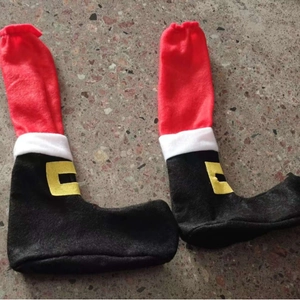 Christmas chair leg covers in red and black boot design with white trim and yellow buckle