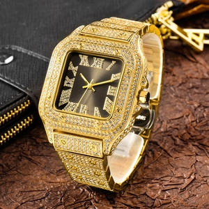 Macro detail of luxury gold-tone square men's watch featuring iced-out diamond-encrusted bezel
