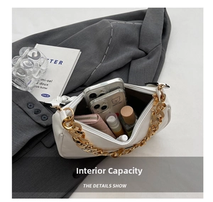 Internal view of the white minimalist underarm bag showing spacious storage capacity