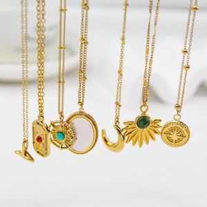 Set of seven gold stainless steel necklaces with natural stone and white shell pendants