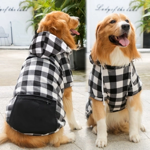 Detail of buffalo plaid pet hoodie featuring a large zipper pocket and white drawstrings