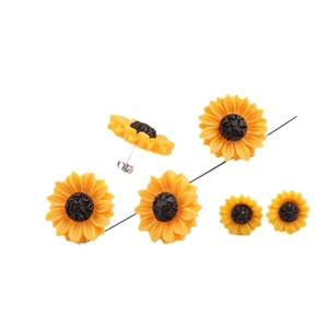 Three pairs of sunflower resin stud earrings in yellow and brown with silver posts
