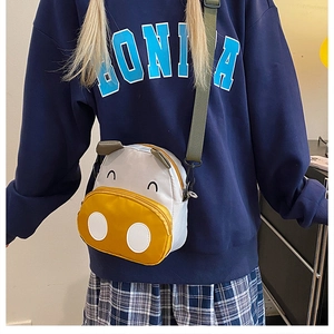 Cute cartoon cow canvas backpack for toddlers with adjustable green shoulder strap