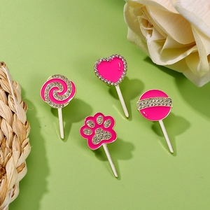 Pink lollipop and cat paw enamel brooches set with gold metal and rhinestones