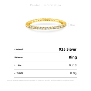 Detail view of 925 sterling silver ring with white zircon stones and gold plating