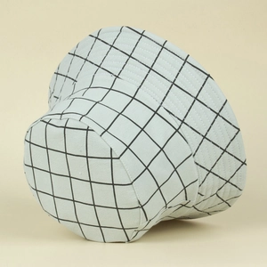 Detail of light blue plaid bucket hat showing breathable fabric and classic grid pattern