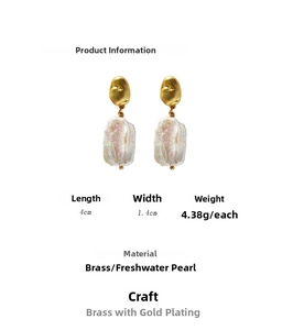 Detailed view of vintage French baroque pearl earrings with 18k gold plated copper frame