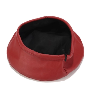 Classic red leather beret hat for women featuring a black lining and adjustable drawstring