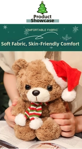 Close-up of soft brown Christmas teddy bear plush with festive red hat and striped scarf