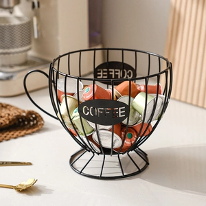 Matte black metal coffee pod holder in a cup shape for countertop kitchen storage