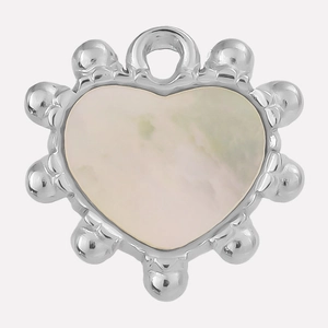 Macro detail of heart pendant with natural shell inlay and beaded stainless steel edges