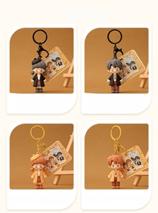 Detail showcase of four cute cartoon couple keychains in black and light brown colors