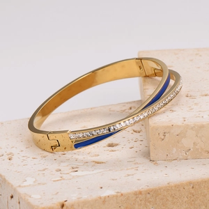 Elegant gold-plated stainless steel wrap bracelet with blue enamel and sparkling zircons