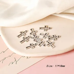 Macro shot of 11mm silver cross pendants with vintage texture for DIY jewelry making