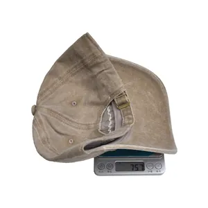 Digital scale showing a weight of 75.7g for the washed cotton MAMA baseball cap