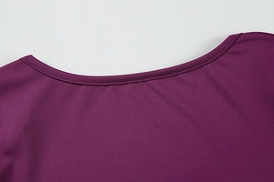 Close-up of neckline stitching and high-quality knit fabric on purple bodycon dress