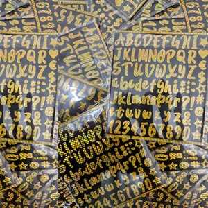1-inch holographic vinyl alphabet stickers in golden finish for scrapbooking names