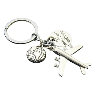 Polished metal airplane keychain with globe and no matter where engraved pendant