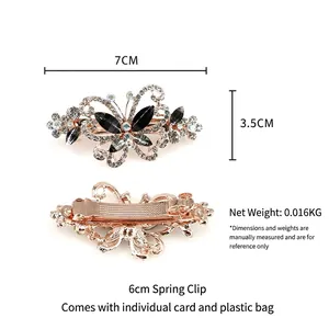 Barrette papillon en or rose avec cristaux noirs et blancs et fermoir à ressort